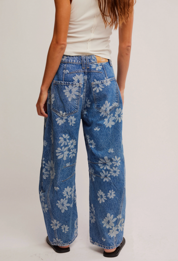 
                      
                        Women's mid-rise medium wash barrel jeans with daisys
                      
                    