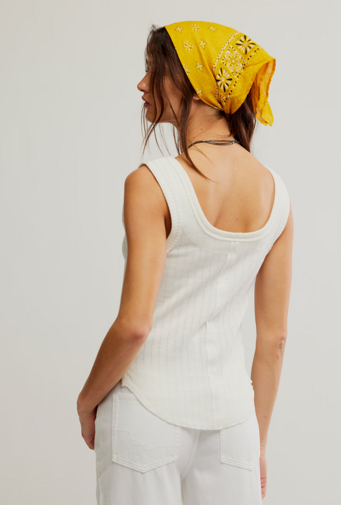 
                      
                        The Free People Bryson Henley Tank features a scoop neck and back with curved hemline
                      
                    