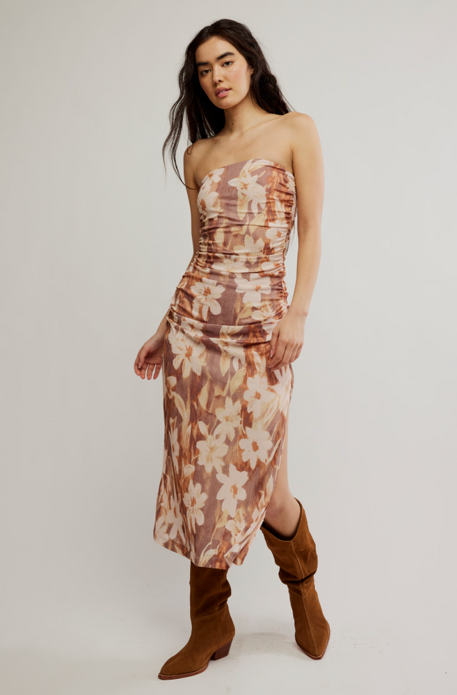 Enjoy the flattering fit and feminine floral print of the Presley Midi Dress by Free People. Find it at Harbour Thread boutique in Burlington, VT!