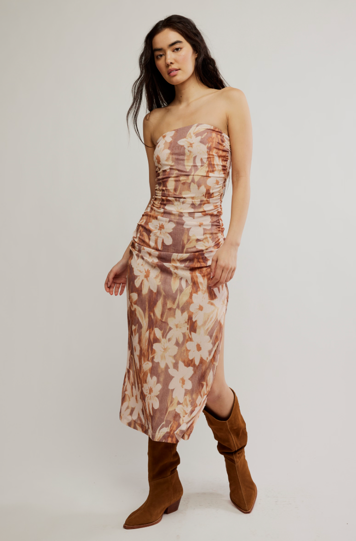 Enjoy the flattering fit and feminine floral print of the Presley Midi Dress by Free People. Find it at Harbour Thread boutique in Burlington, VT!