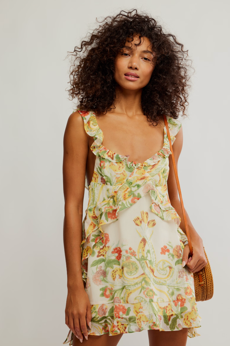 The Free People Bali Flora Mini Dress offers feminine florals and ruffle details. Find it at Harbour Thread boutique in Burlington, VT. 