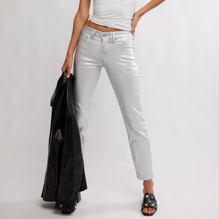 Woman wearing a white tank top and metallic pants from Free People