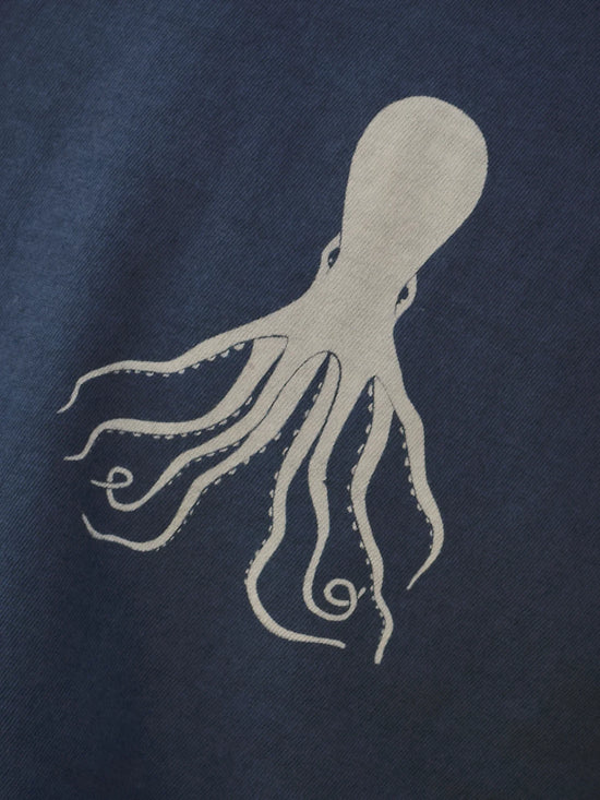 Load image into Gallery viewer, Close up view of the white octopus graphic against the navy color of the shirt
