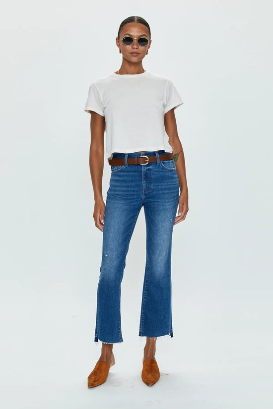Front view of woman wearing medium wash  high rise cropped bootcut jeans by Pistola