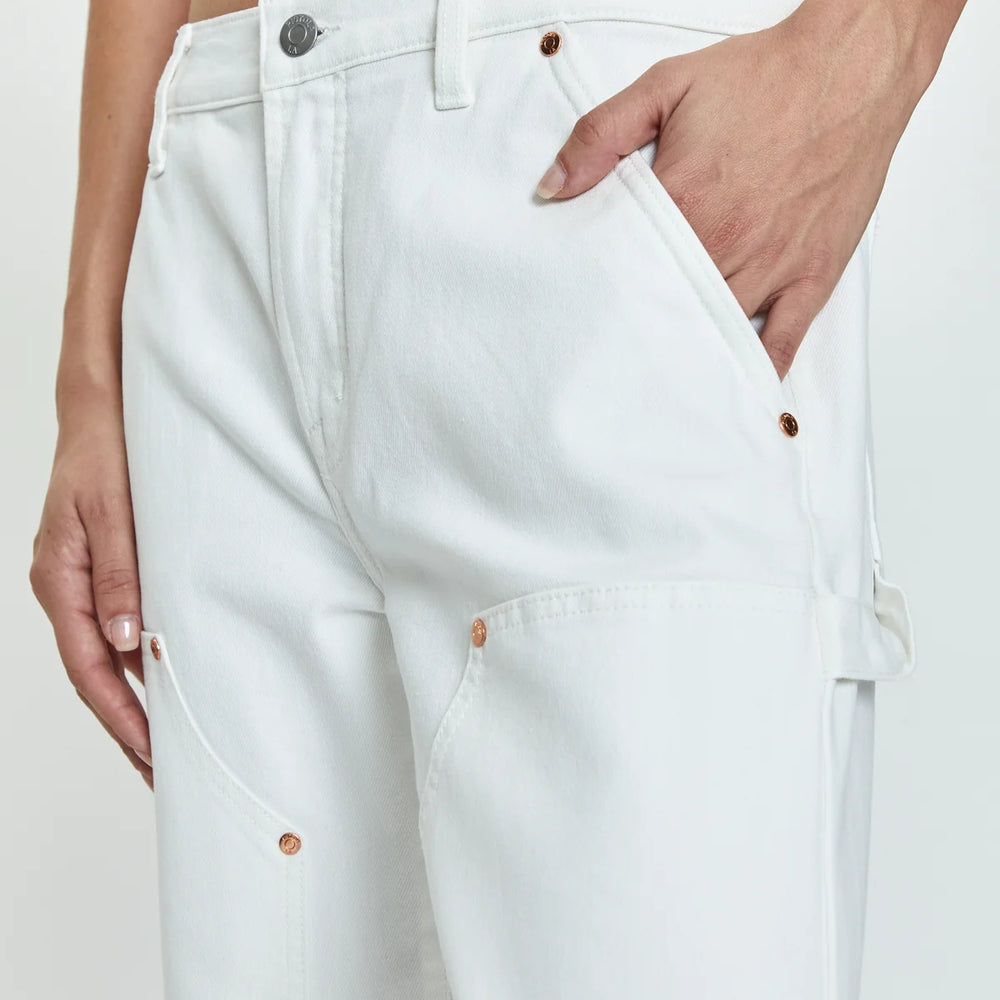 Side detail view of PISTOLA's Lexi Mid Rise Carpenter Jeans in the color White