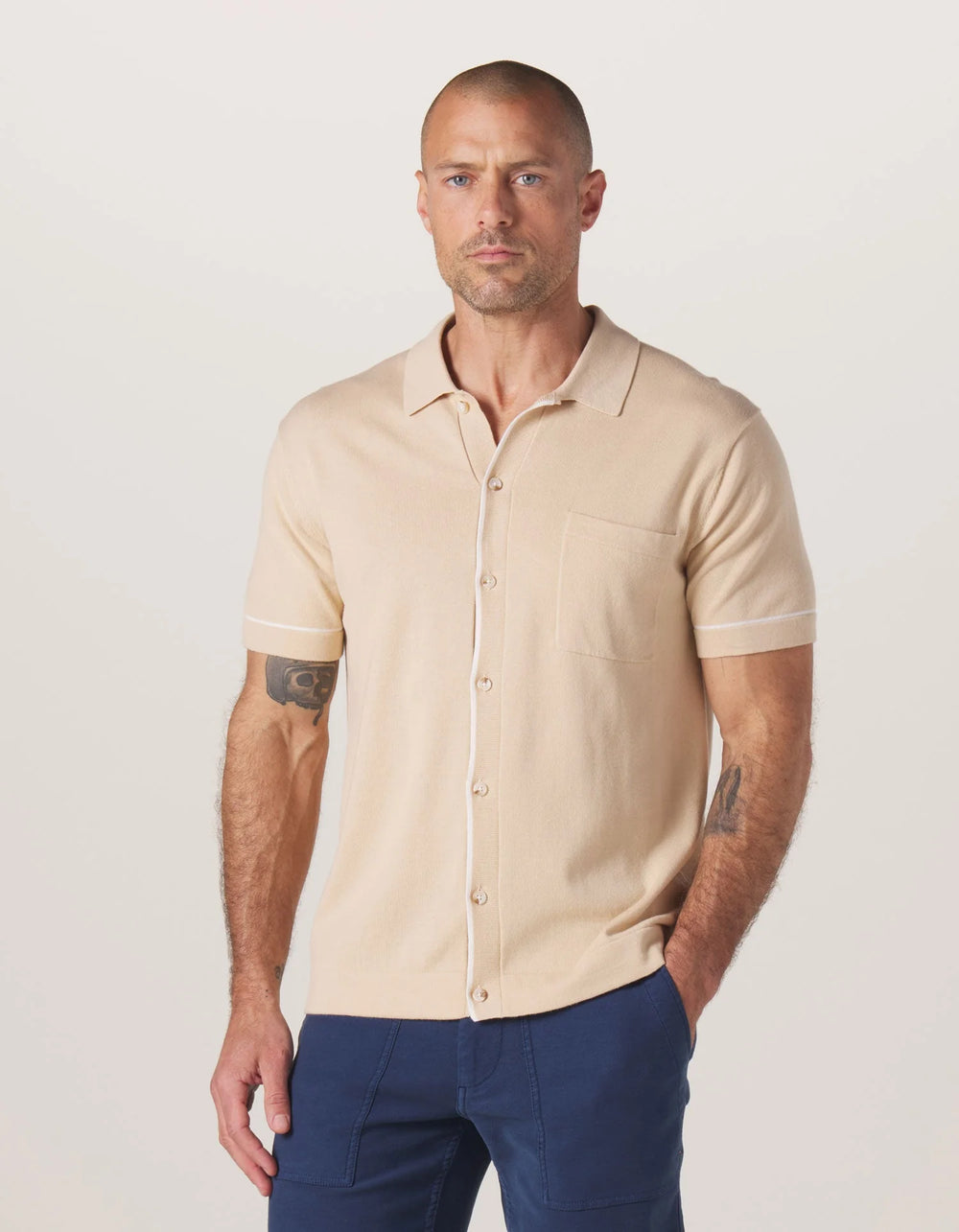 Front view of the The Normal Brand Robles Knit Button Down in the color Tan/Cream