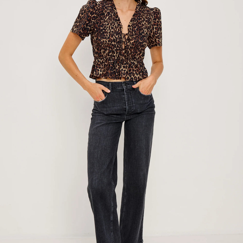 
                      
                        Woman wearing the Rails Portia Top paired with dark wash jenas
                      
                    