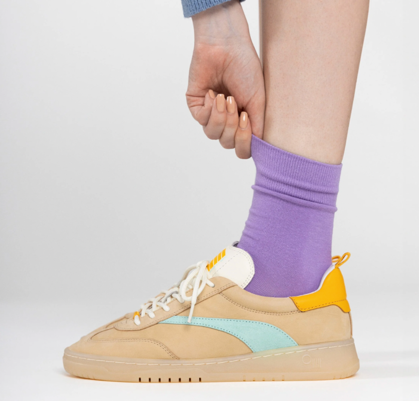 
                      
                        A person wearing the Oak Panama Sneaker by Oncept
                      
                    