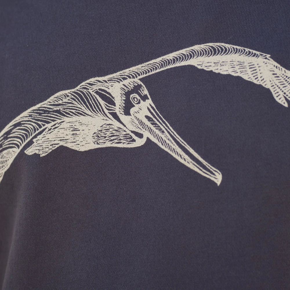 
                      
                        Close up of the pelican graphic on the front of the Pelican Pullover by Mollusk
                      
                    