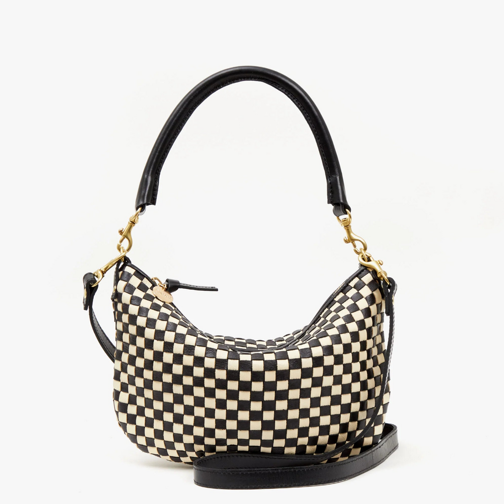 The Black and Cream Woven Checker Petit Moyen bag by Clare V. offers versatile accessory style. 