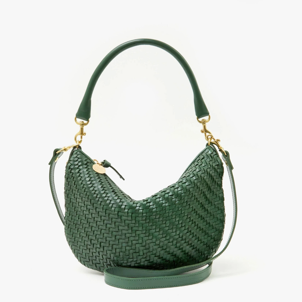 
                      
                        Versatile dark green woven messenger bag from Clare V.
                      
                    