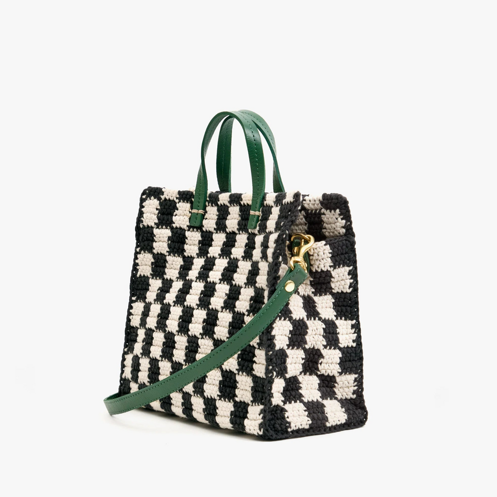 Clare V. black and white crochet tote with green leather straps