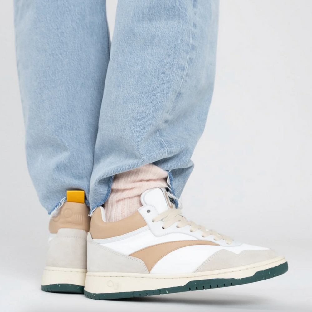 
                      
                        A person wearing the Princeton Mid-Top Sneaker by Oncept
                      
                    