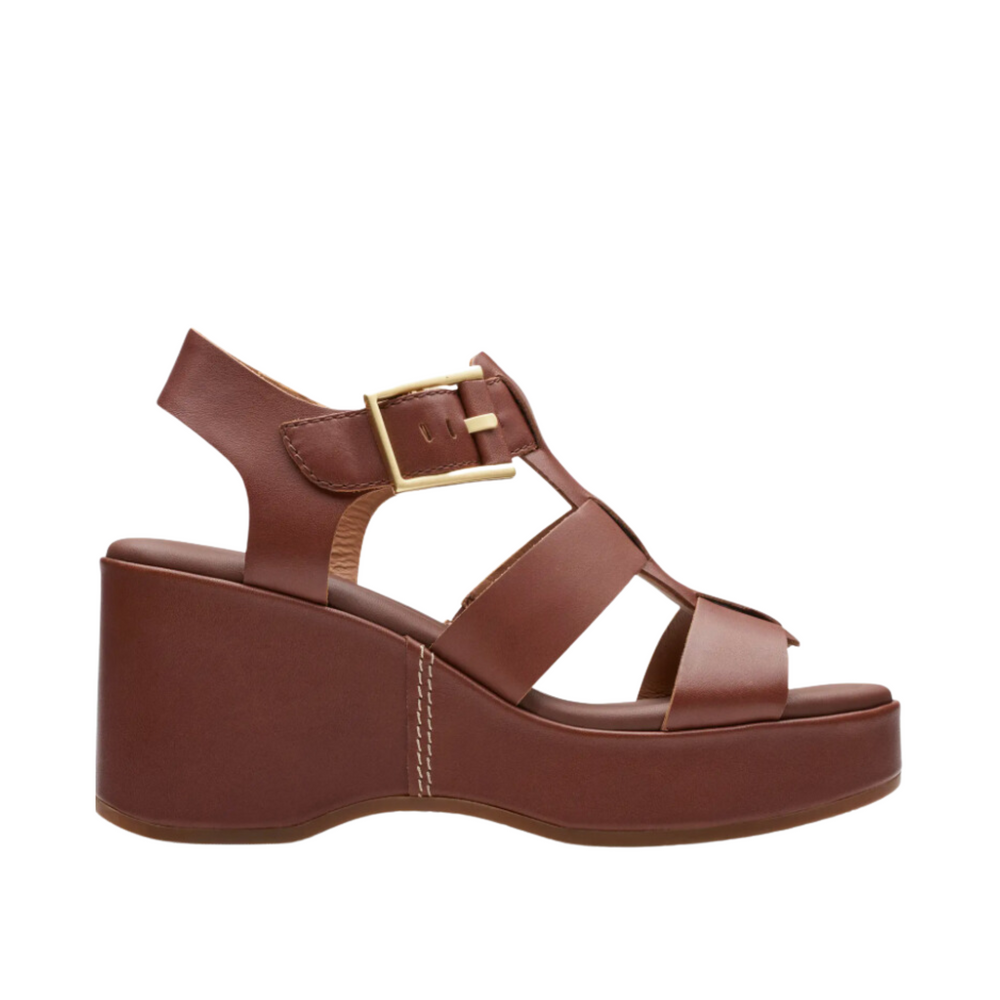 
                      
                        Side view of the  tan leather Manon Cove Wedge Sandals from Clarks
                      
                    