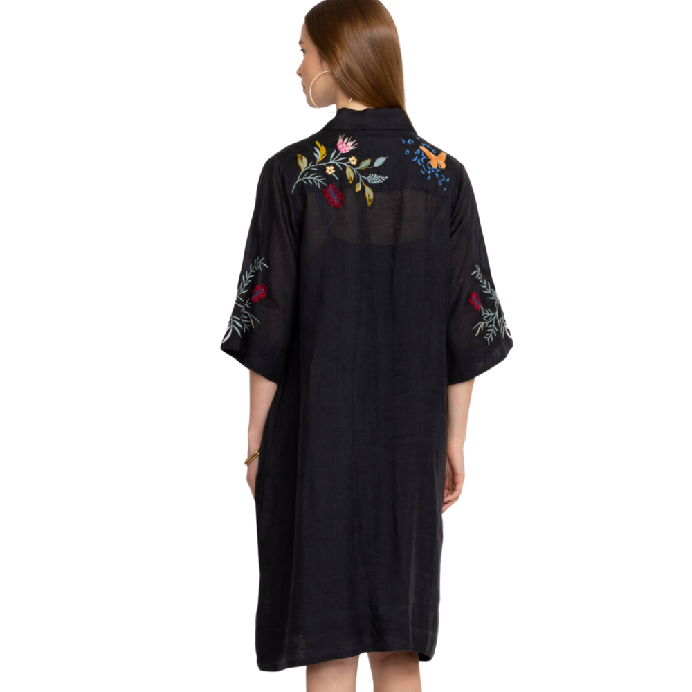
                      
                        Back view of woman wearing the black henley kimono sleeve dress with embroidery detail by Johnny Was
                      
                    