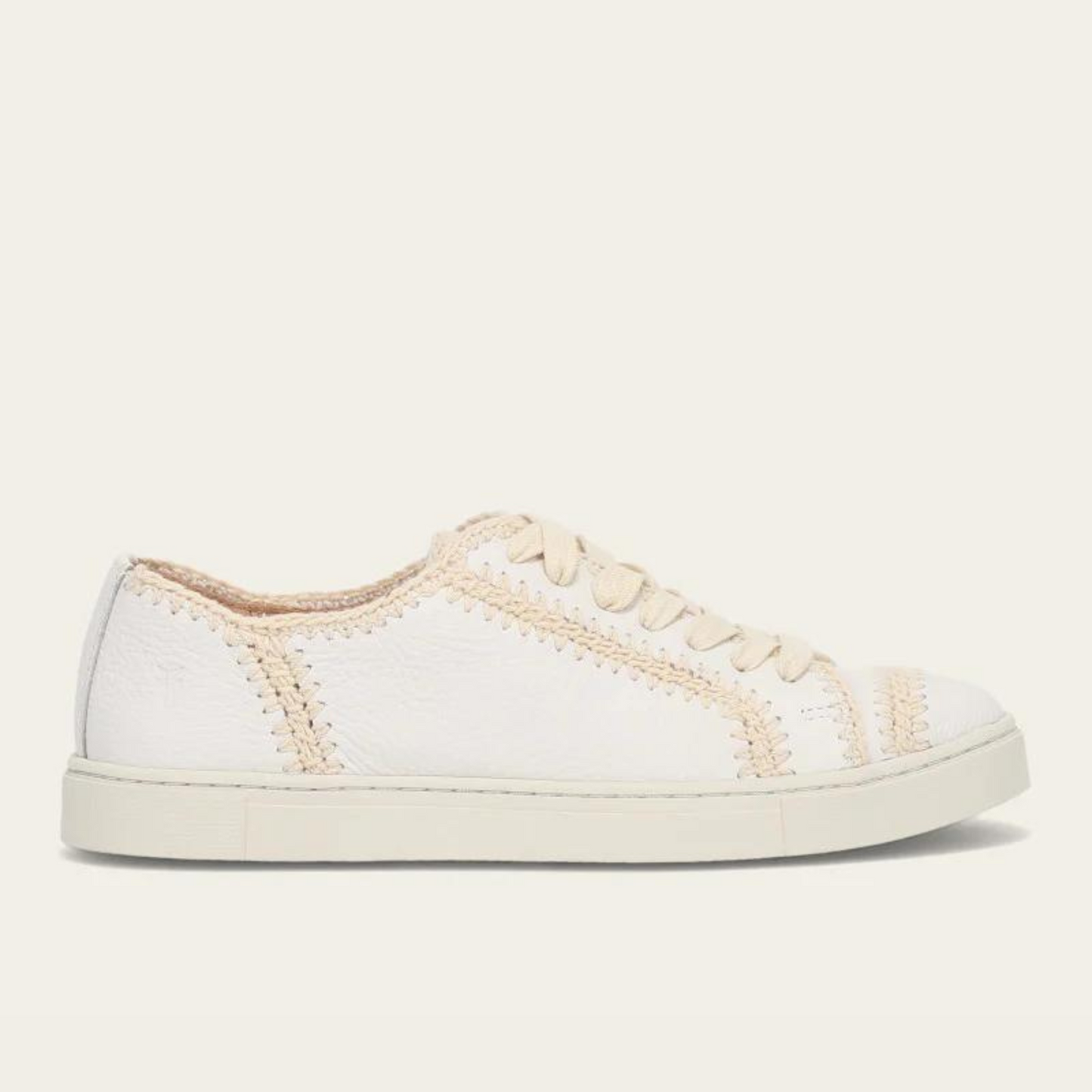 Side view of Women's white crochet stitched low top lace up sneaker by FRYE