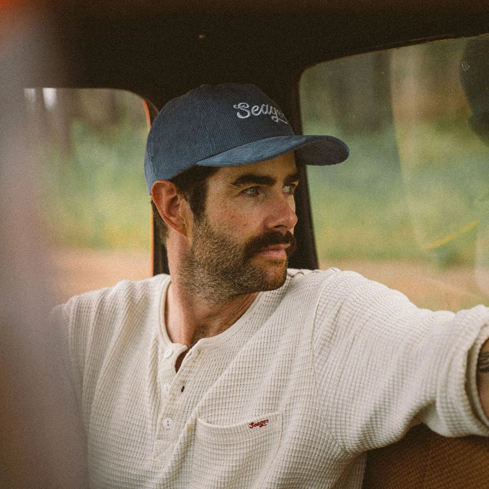 Man wearing the Big Blue Corduroy Snapback hat by Seager