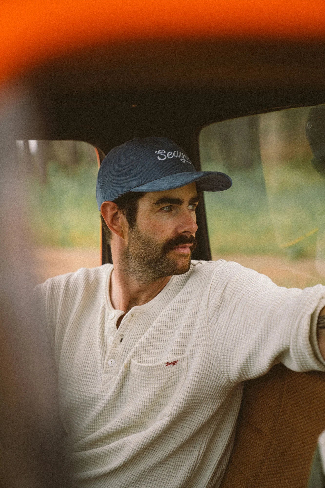 Man wearing the Big Blue Corduroy Snapback hat by Seager