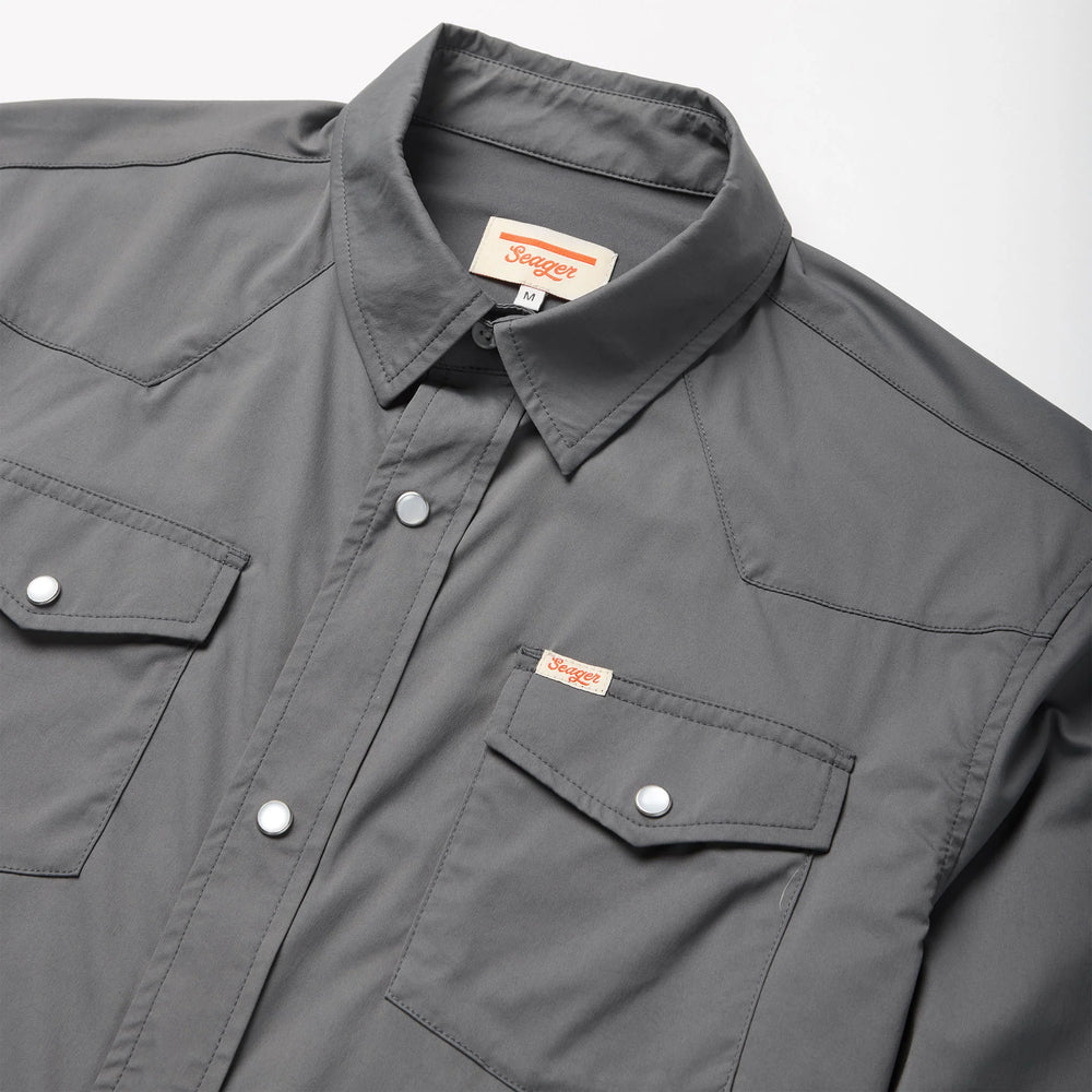 
                      
                        This pearl snap shirt features Western yoke over shoulders
                      
                    