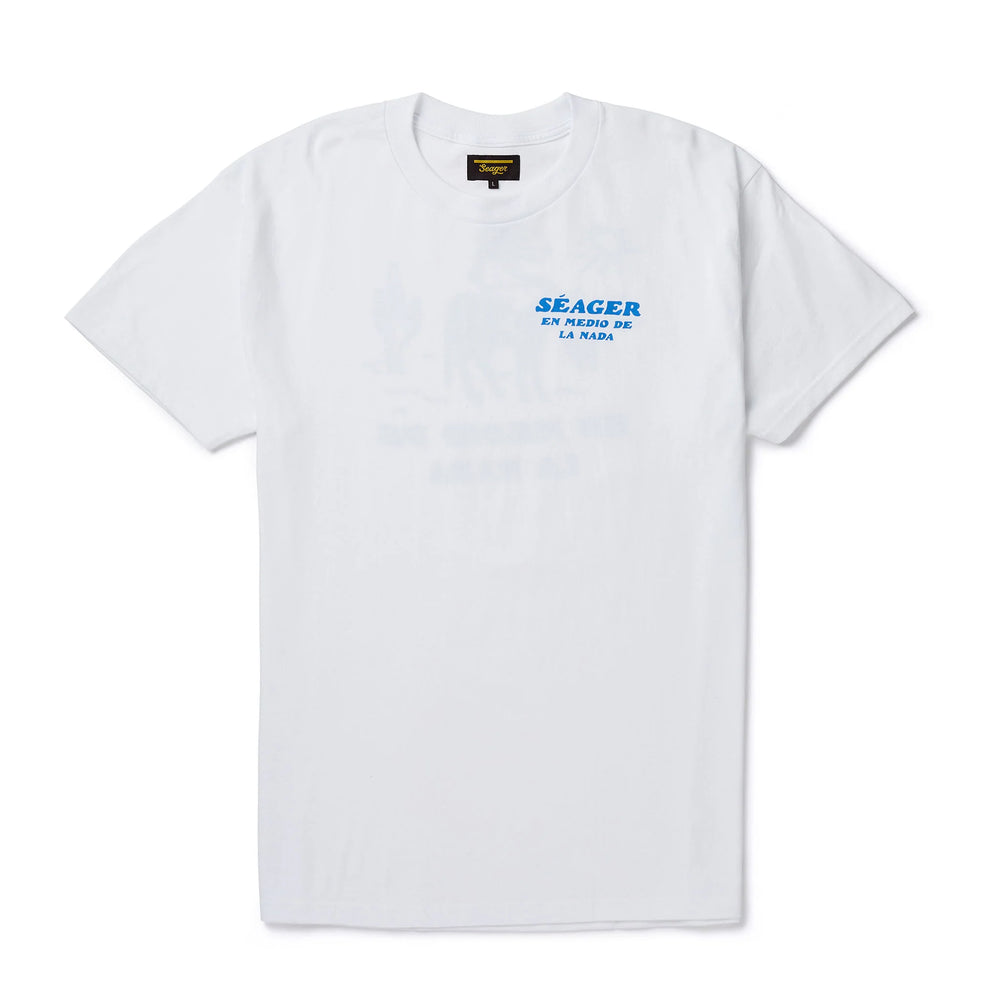 
                      
                        Front view of the white short sleeve Nowhere Tee from Seager, featuring a left chest graphic with "en medio de la nada" printed under the brand name. 
                      
                    