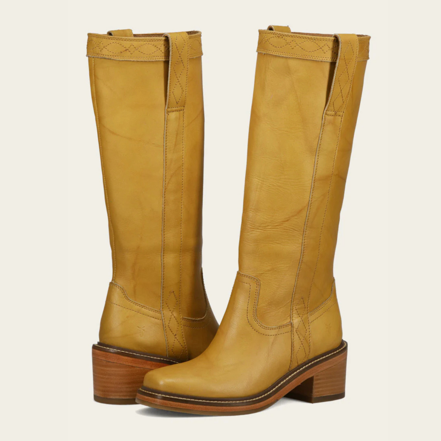 A pair of women's yellow leather pull on riding boots from FRYE
