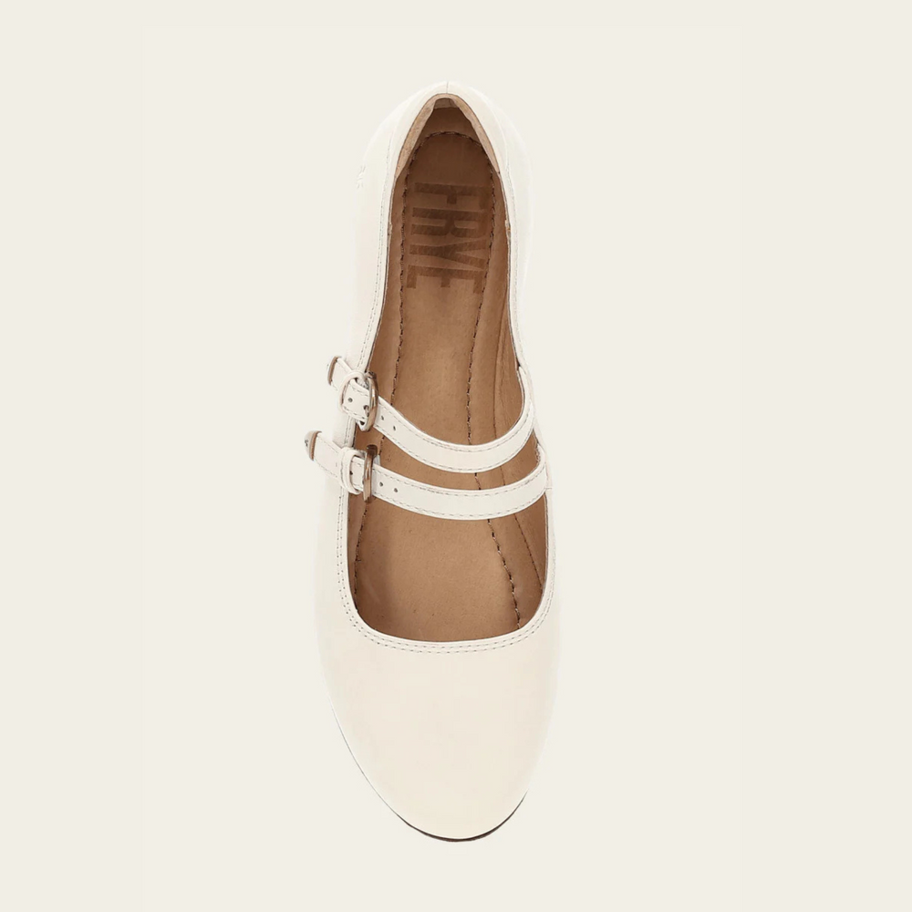 
                      
                        White flat shoe with a double strap
                      
                    