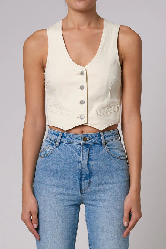 Front view of women's cream colored tailored denim vest with front button closure