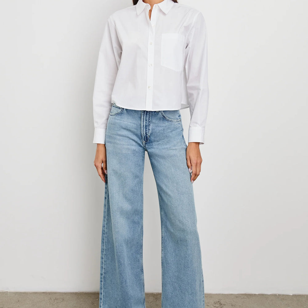 
                      
                        Woman wearing a cropped white button down shirt from Rails
                      
                    