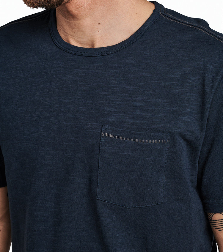 
                      
                        Front detail on the Navy Well Worn Midweight Organic Cotton Tee by Roark
                      
                    