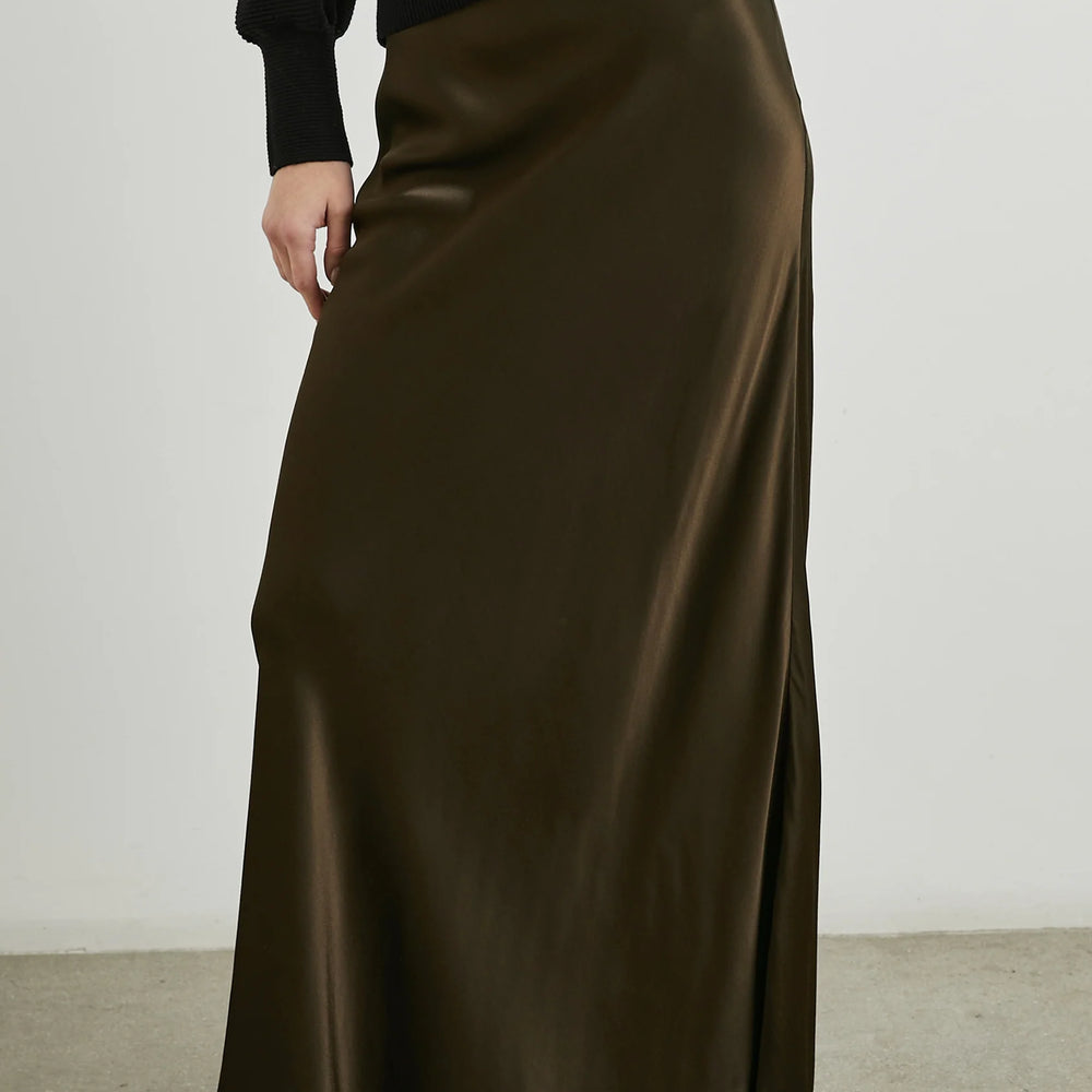 
                      
                        The Romina is a bias cut satin crepe skirt
                      
                    