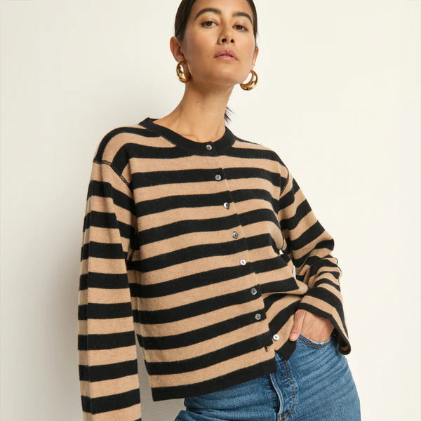 A woman wearing the striped Rosetta Cardigan by Nation LTD