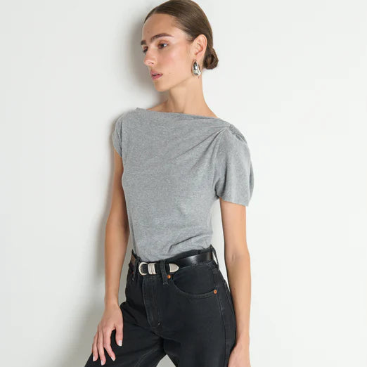 Woman wearing a gray top and black pants from Nation LTD