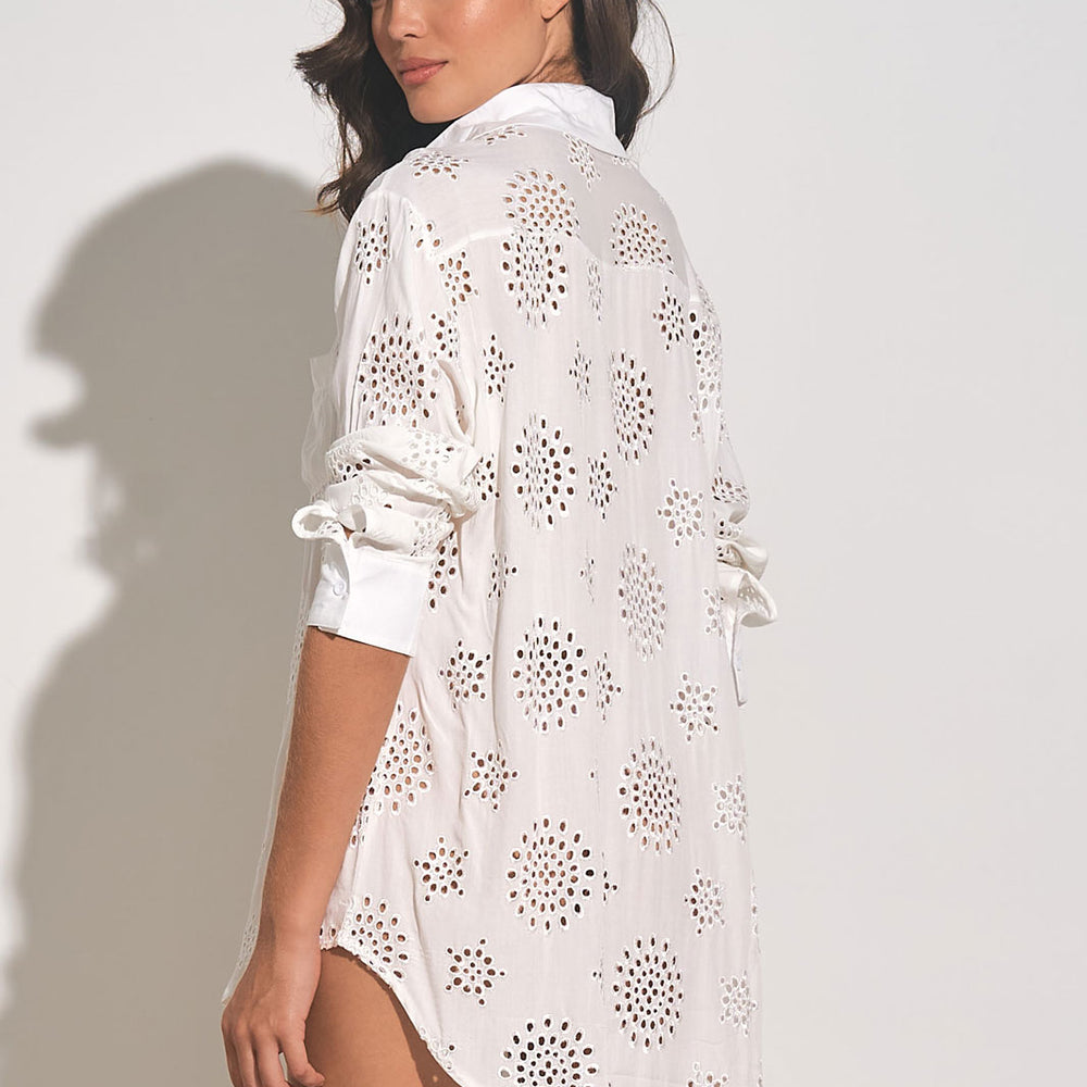 
                      
                        back view of woman wearing a white long sleeve button down cover up shirt with eyelet embroidery throughout
                      
                    