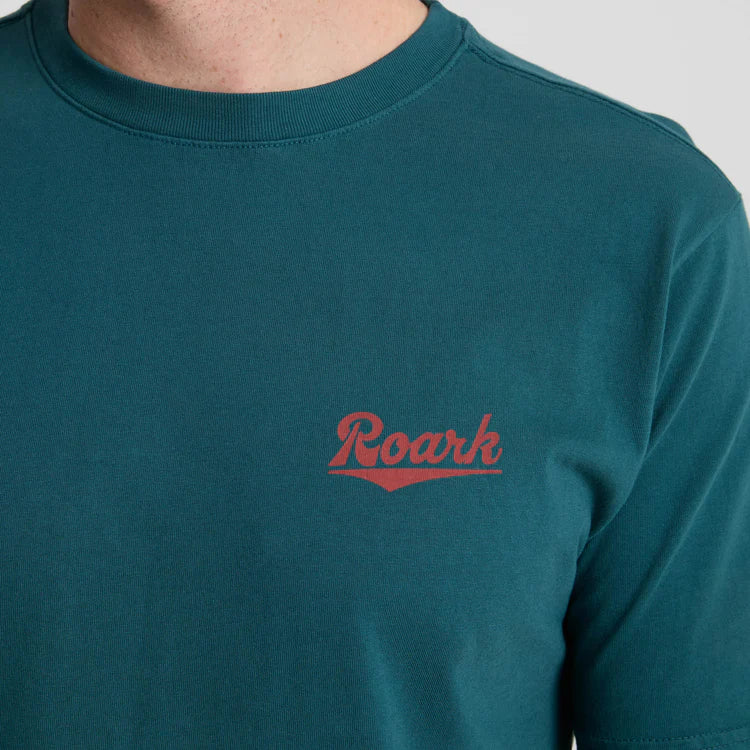 
                      
                        The Roark Diamond Script Premium Tee is crafted from premium, soft cotton in a rich Deep Sea tone
                      
                    