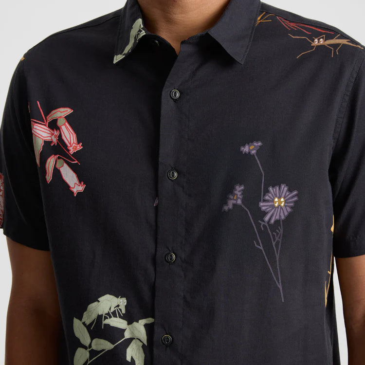 
                      
                        The Roark Gonzo Short Sleeve Button Up Shirt features a black base with a multicolor floral print
                      
                    