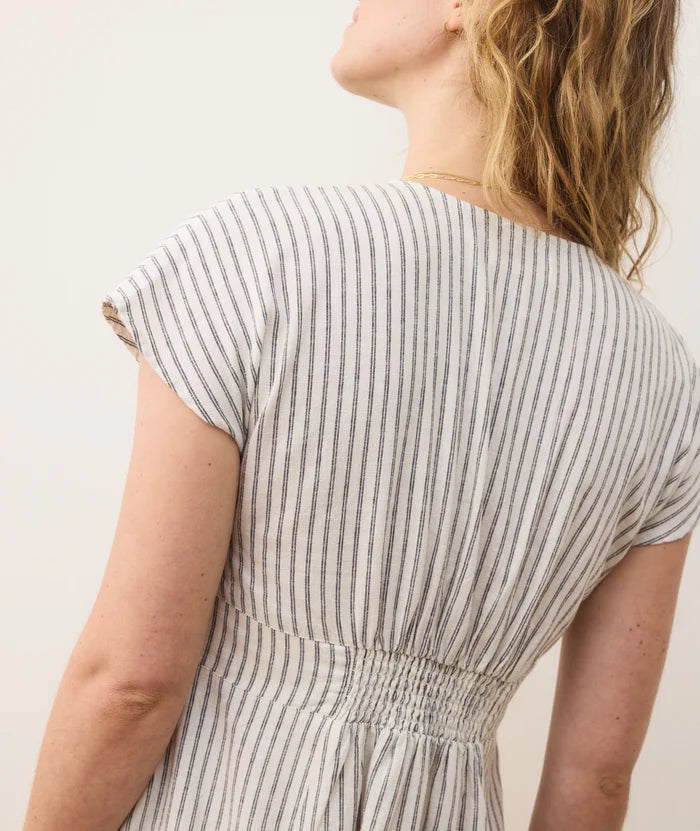 The Marine Layer Camila Mini Dress offers short ruffle sleeves and back smocking for a flattering fit. Shop this striped mini dress at Harbour Thread boutique in Burlington, VT!