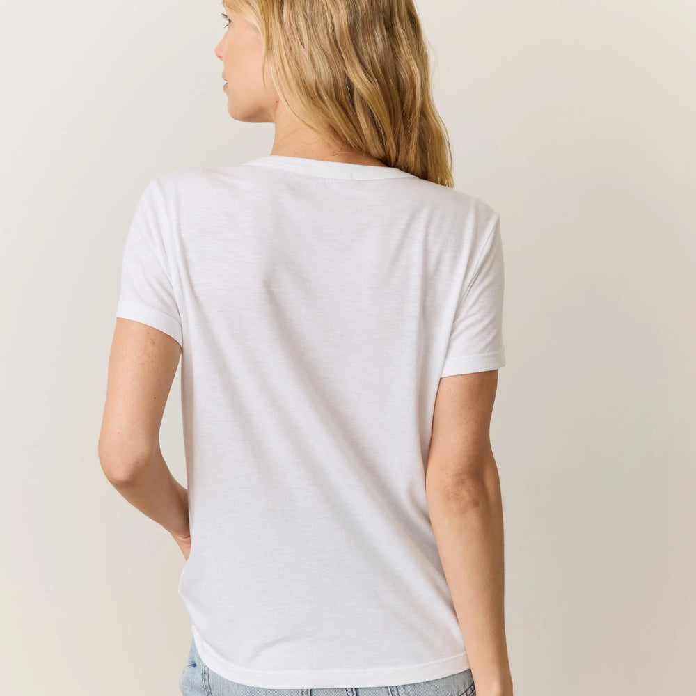 
                      
                        Woman wearing a plain white t-shirt with jeans
                      
                    