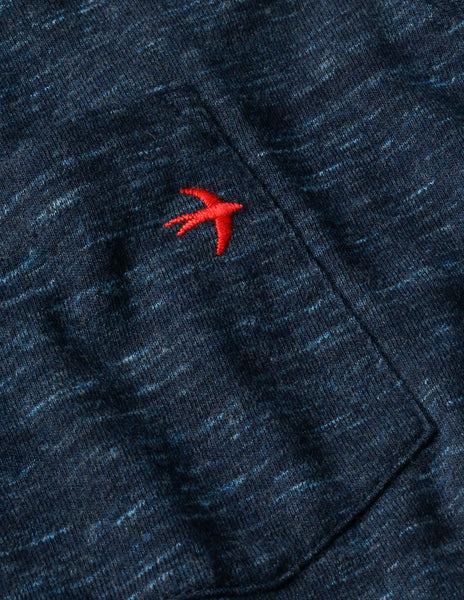 
                      
                        Design detail on Relwen's Ringspun Pocket Tee in the color Navy Marl
                      
                    