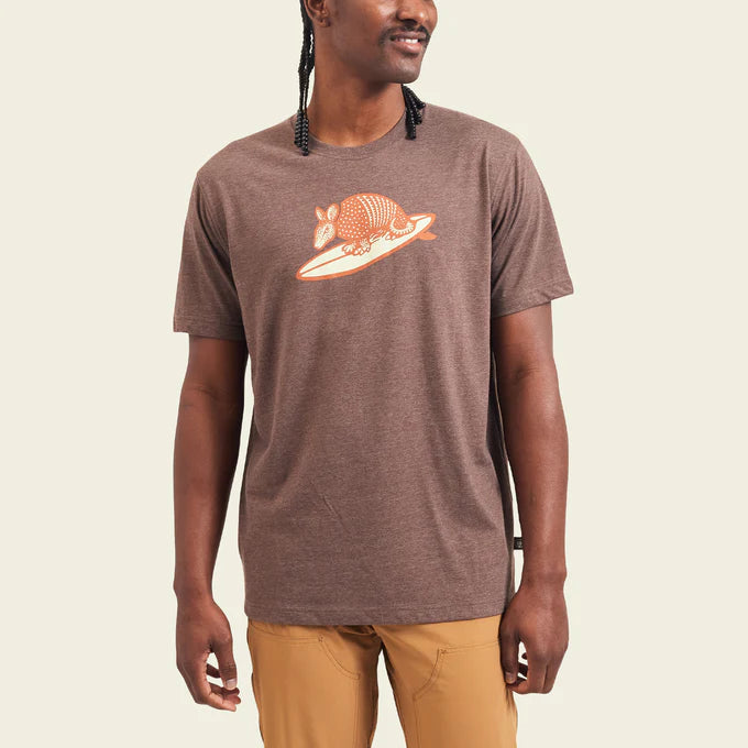 Front view of man wearing a brown short sleeve t-shirt with an armadillo graphic on the front