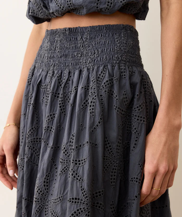 Embrace effortlessly cute and comfortable warm-weather style in the Marine Layer Bea Eyelet Midi Skirt. Shop yours at Harbour Thread boutique in Burlington, VT!
