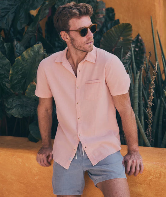 Man outside wearing the Coral Short Sleeve Stretch Selvage Shirt by Marine Layer