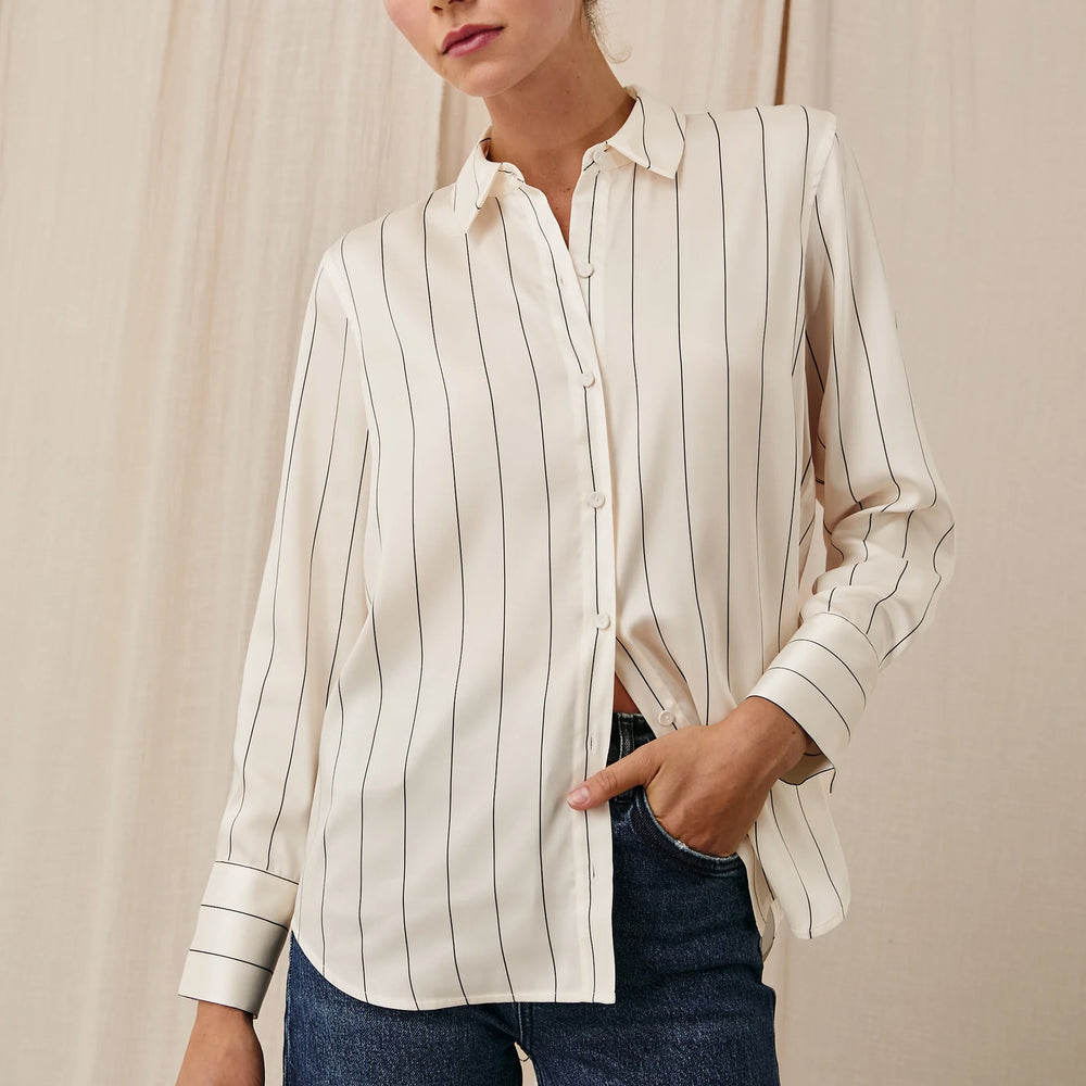 A woman wearing the Brixton Stripe Saige Shirt by the brand Rails