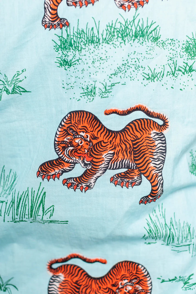 
                      
                        Tiger print on a light blue men's shirt
                      
                    