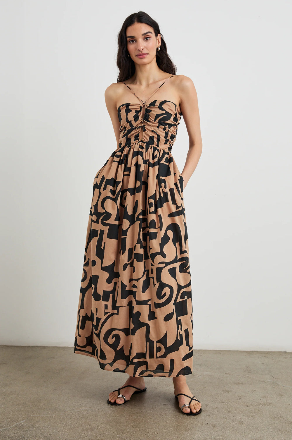 The Rails Silvia Maxi dress features side pockets, an abstract print, and a comfortable and flattering fit. Shop now at Harbour Thread for an easy-to-wear elevated look. 