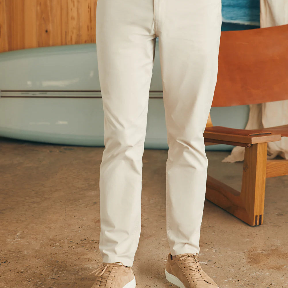 Front view of man wearing the Movement™ 5-Pocket Pant in color Light Sand by Faherty