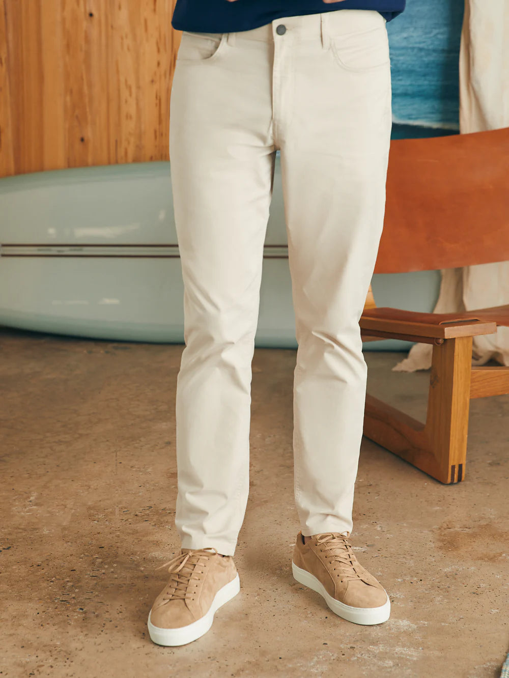 Front view of man wearing the Movement™ 5-Pocket Pant in color Light Sand by Faherty