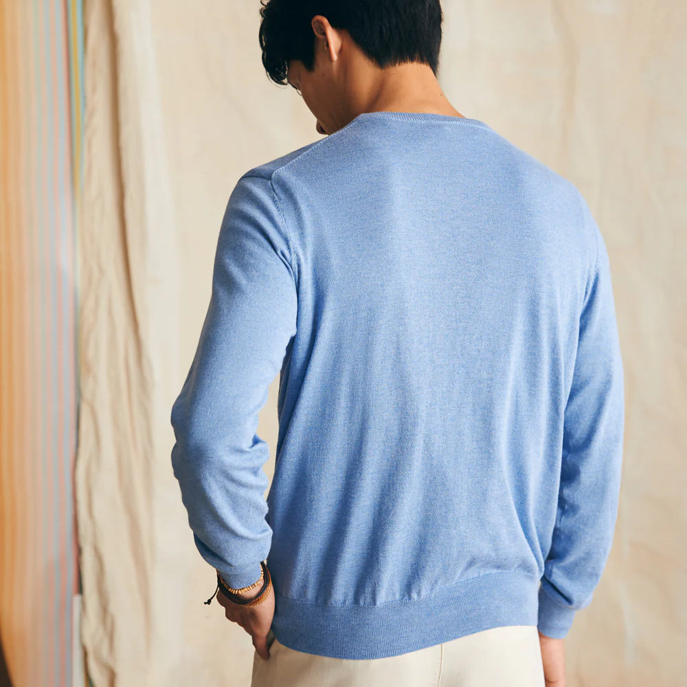 
                      
                        Back view of Faherty's Movement Crewneck Sweater in the color Azure Sky Heather
                      
                    