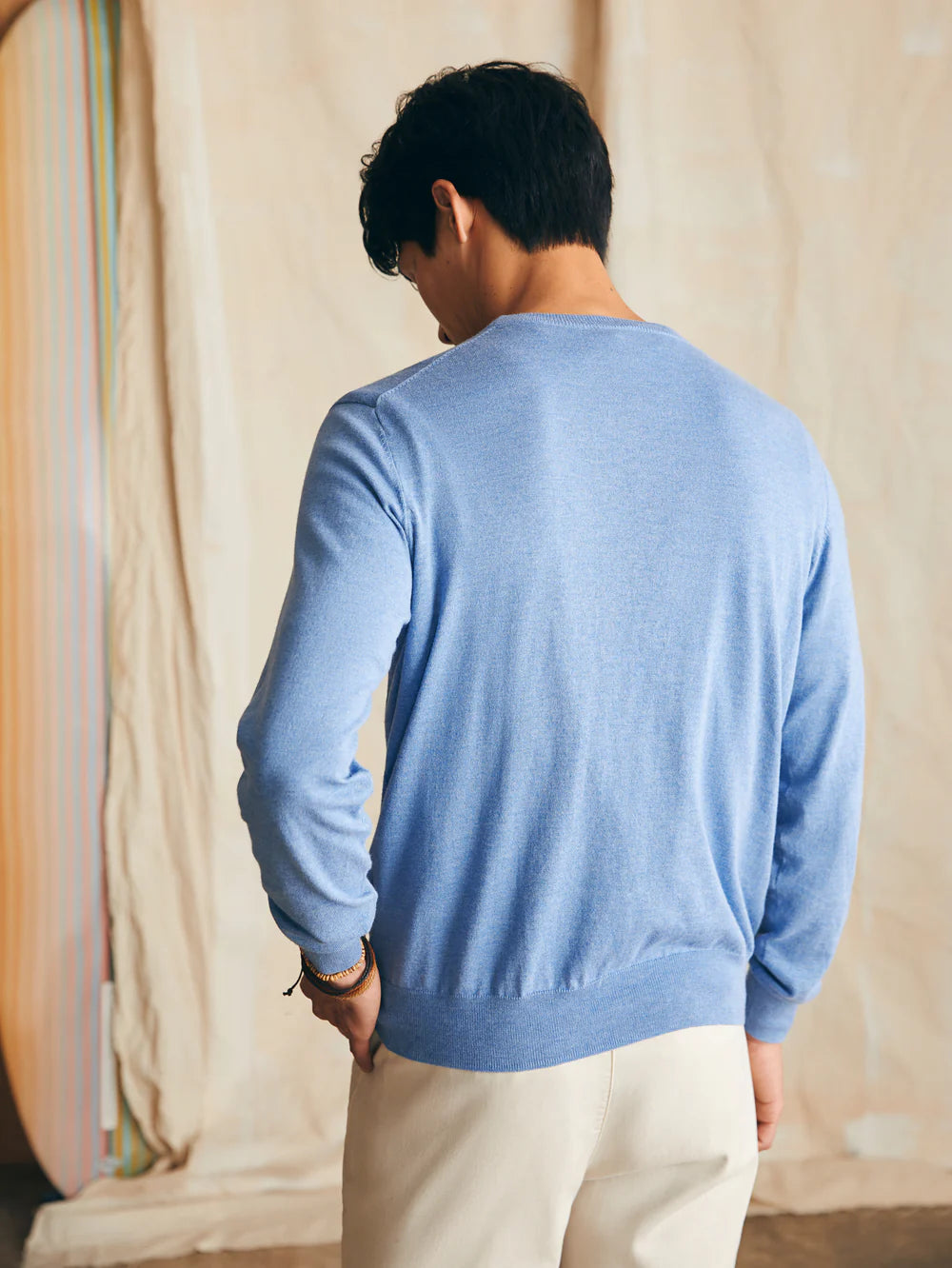 Back view of Faherty's Movement Crewneck Sweater in the color Azure Sky Heather