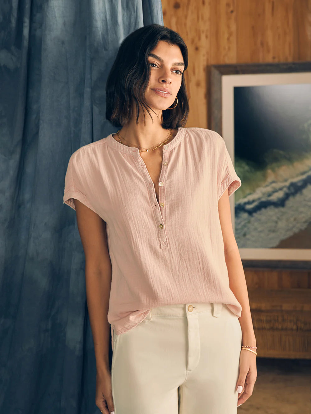 Front view, tucked in styling for the Faherty Dream Cotton Gauze Desmond Top in the color Peach Whip