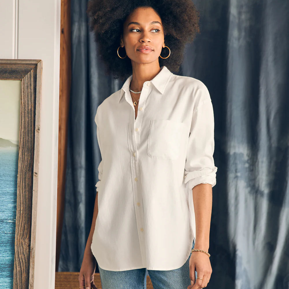 
                      
                        Front view of a woman wearing Faherty's Stretch Oxford Relaxed Shirt in the color White
                      
                    